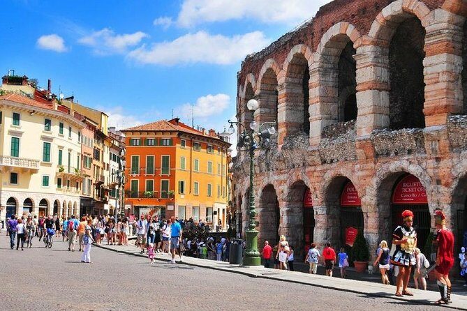 Discover the City of Romeo & Juliet: Walking Tour of Verona - Crossing toward the Arena: river views and Roman scale