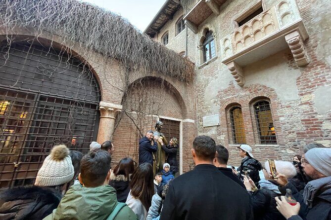 Verona: City Walking Tour with Cable Car Ride & Wine Aperitif - Adige riverfront stroll and Saint Thomas Island views
