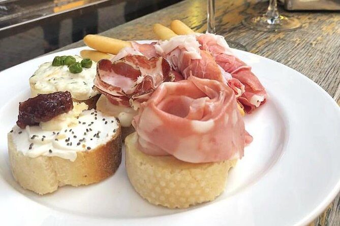 Verona Full Meal & Wine Tasting Walking Tour by Do Eat Better - Via Sottoriva hearty main: polenta with Pastissada or cod